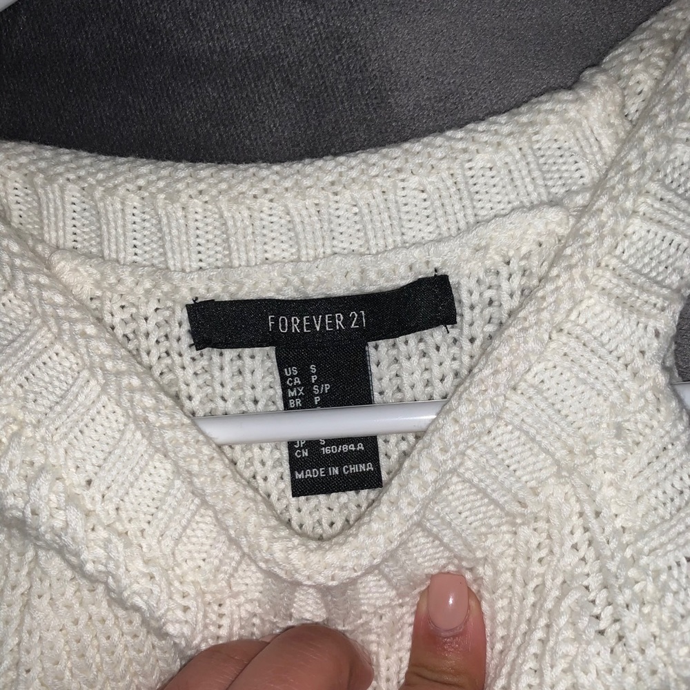 White sweater with cropped out shoulders